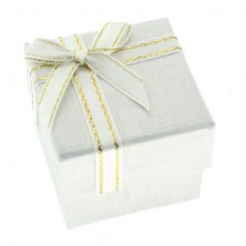 White gift box with Greek pattern and ribbon