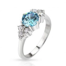 Steel ring - protuberant blue zircon in middle and clear rhinestones