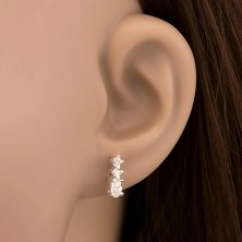 Silver stud earrings - row of three glimmering zircons